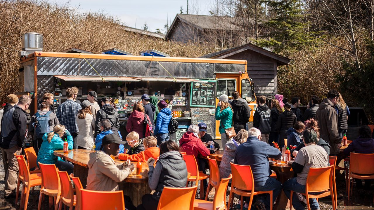 People gather at the Tacofino taco truck in Tofino, Canada.